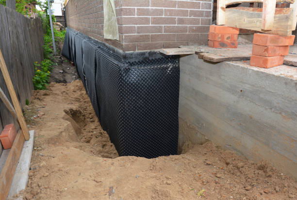 SJ Waterproofing Pros technician performing targeted Emergency Waterproofing assessment in Spencerport, NY
